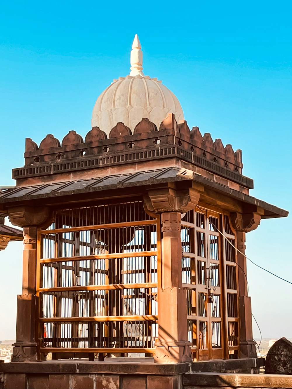 a large wooden structure with a white dome on top