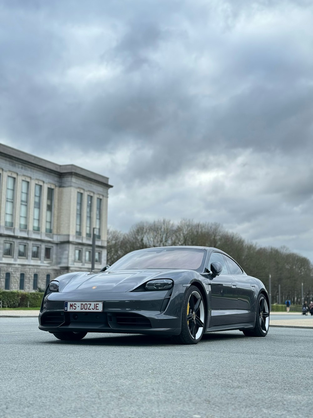 a black sports car parked in front of a building