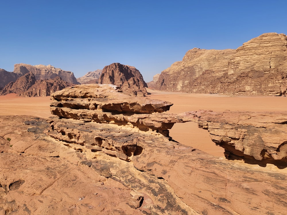 a rock formation in the middle of a desert