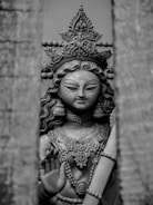 a black and white photo of a statue