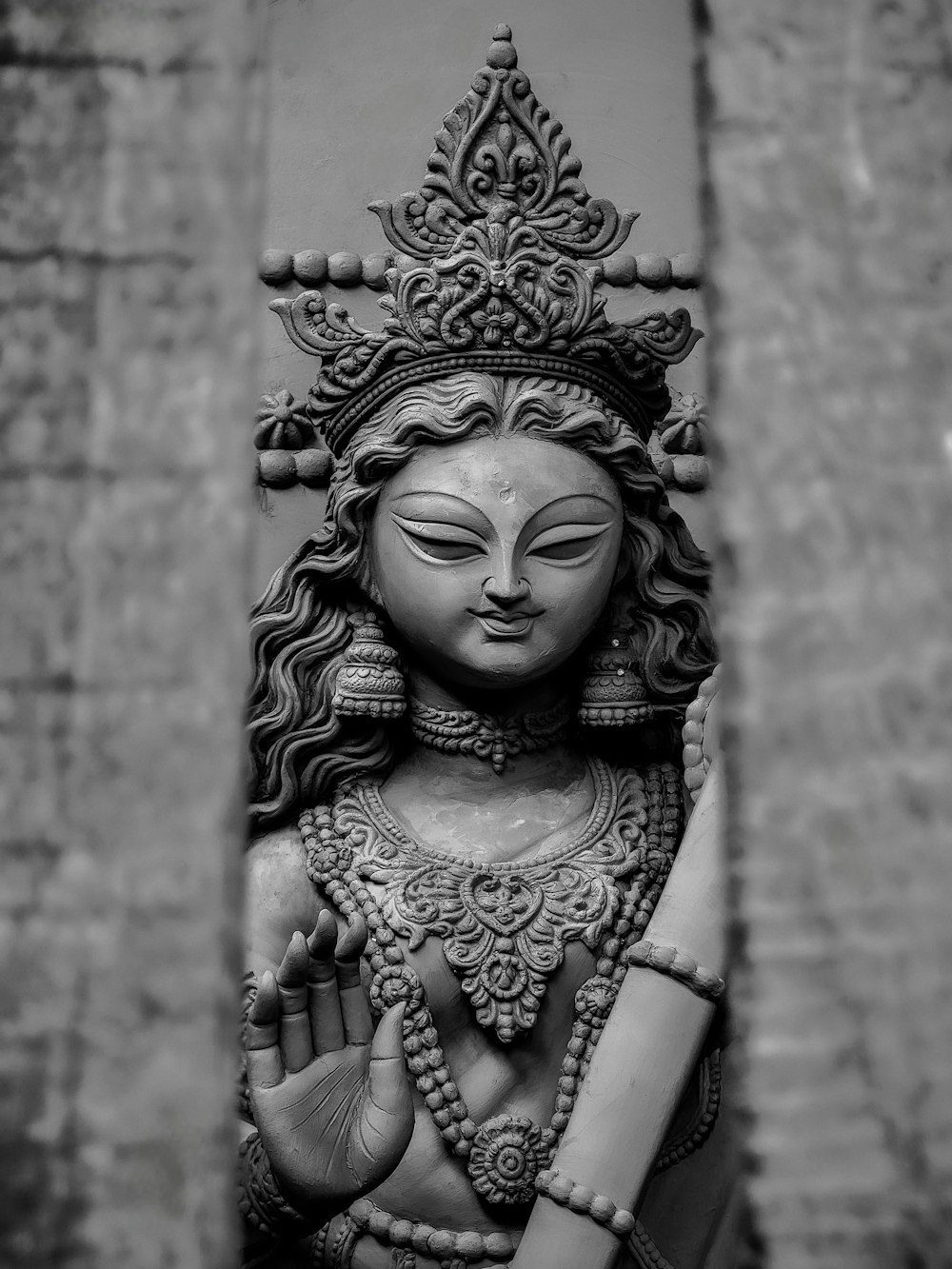 a black and white photo of a statue