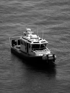 a black and white photo of a boat in the water