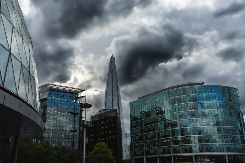 a cloudy sky over a city with skyscrapers