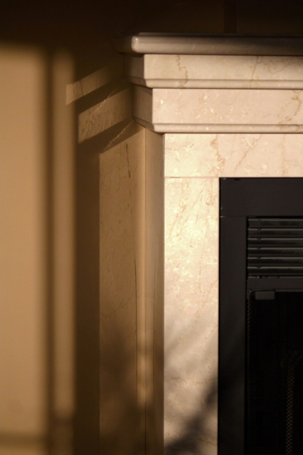 a fireplace with a clock on the mantle