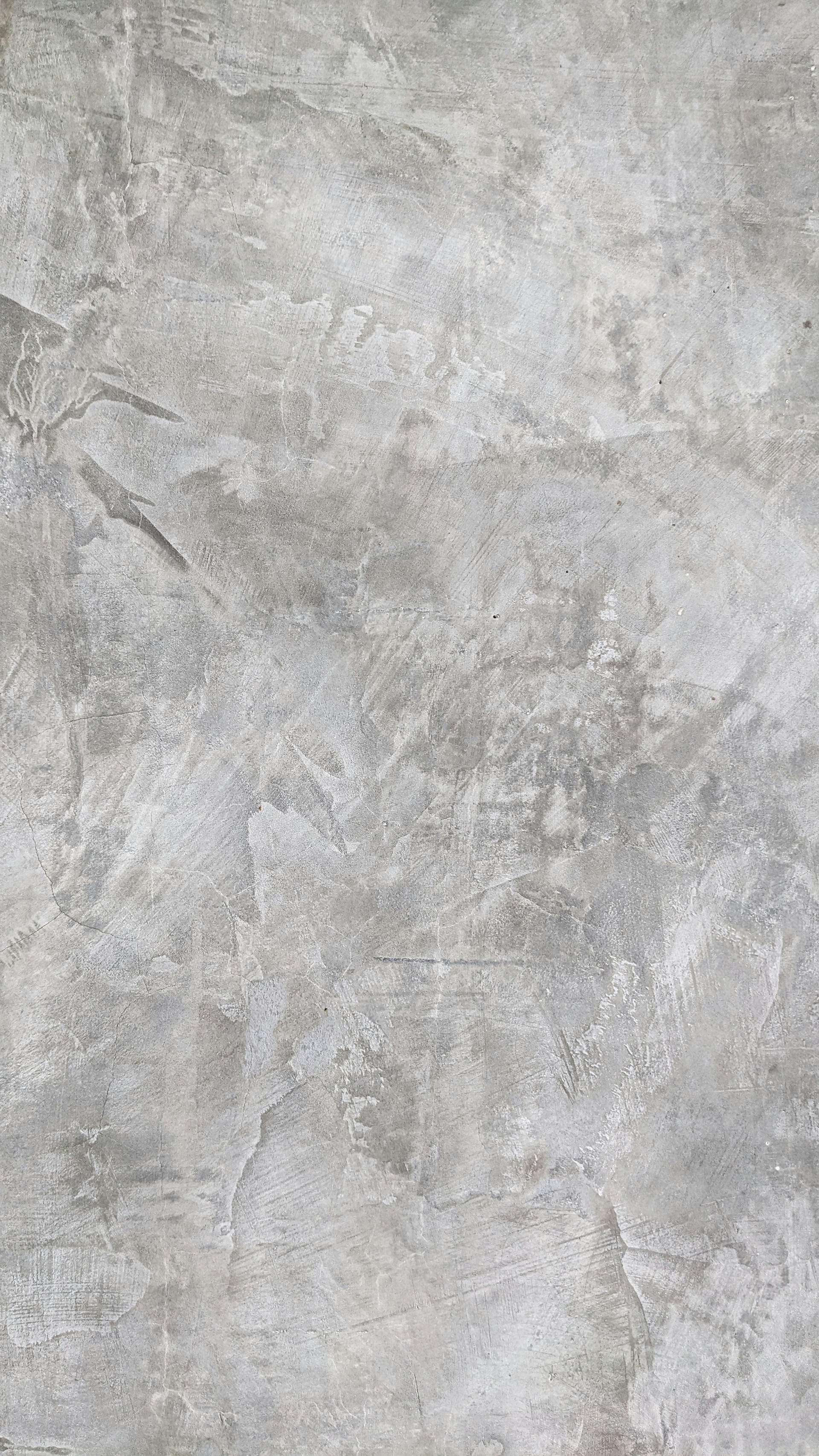 a white and gray wall with a clock on it
