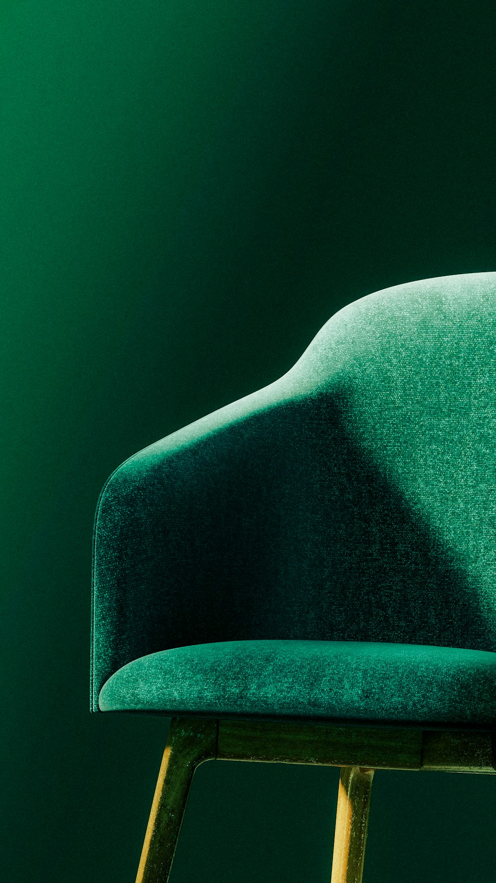 a green chair sitting on top of a wooden stool