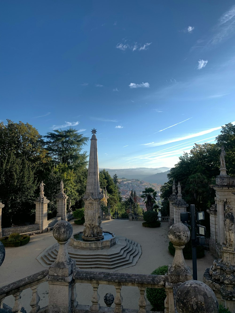 a view of a fountain in the middle of a park