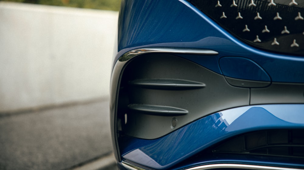 a close up of a blue car with an american flag painted on it