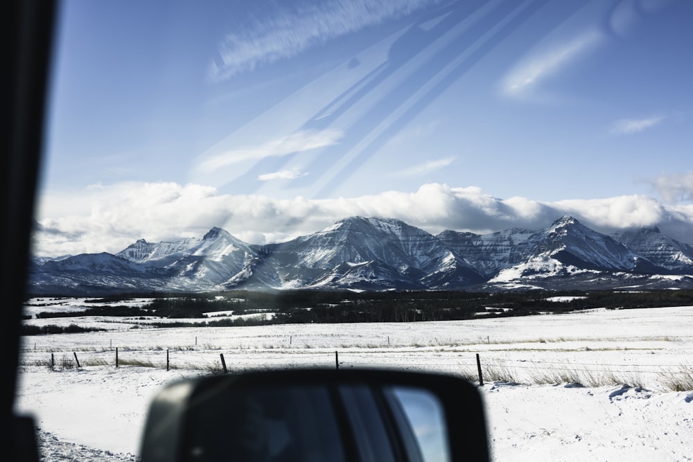 a view of a mountain range from a car window