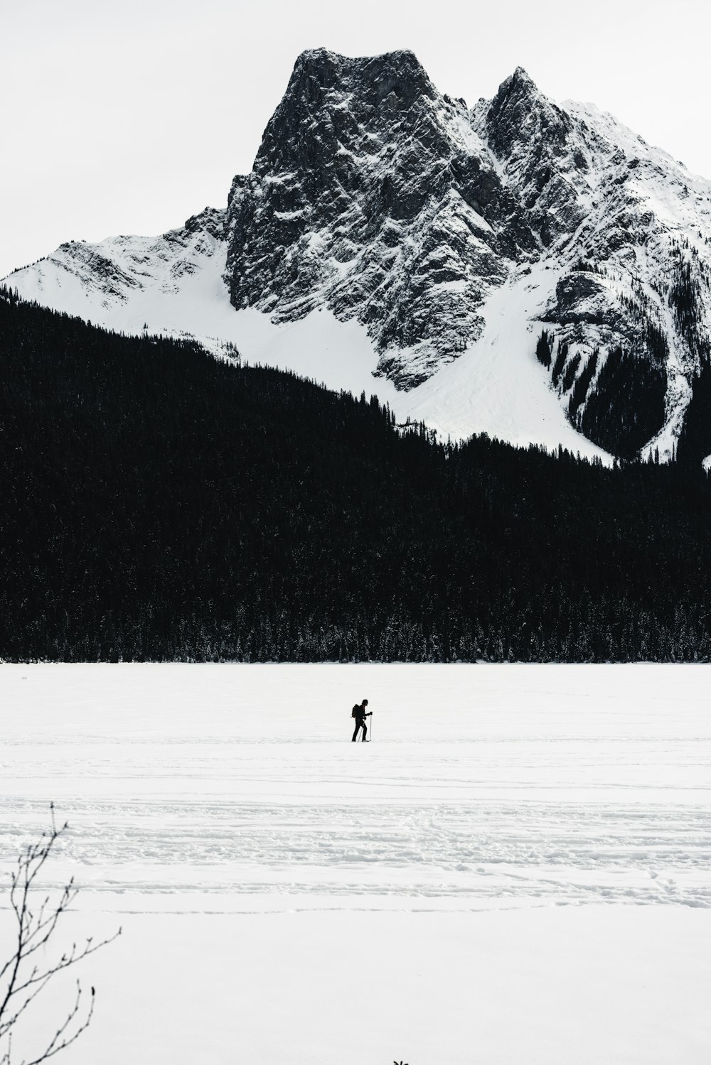 a person walking across a snow covered field