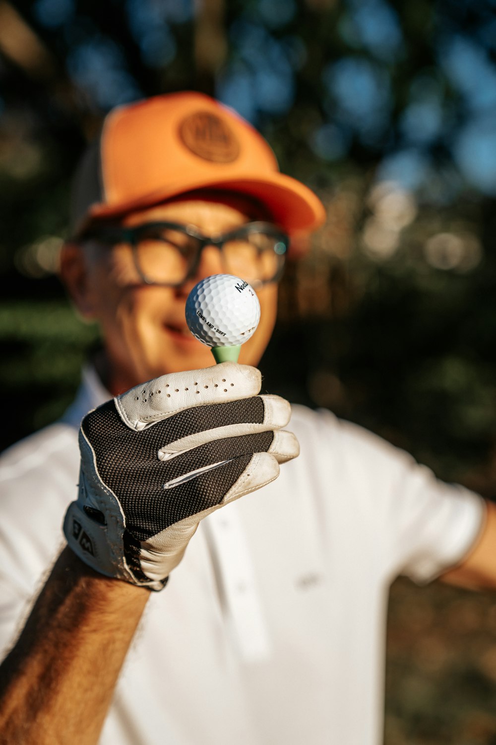 a man holding a golf ball in his left hand