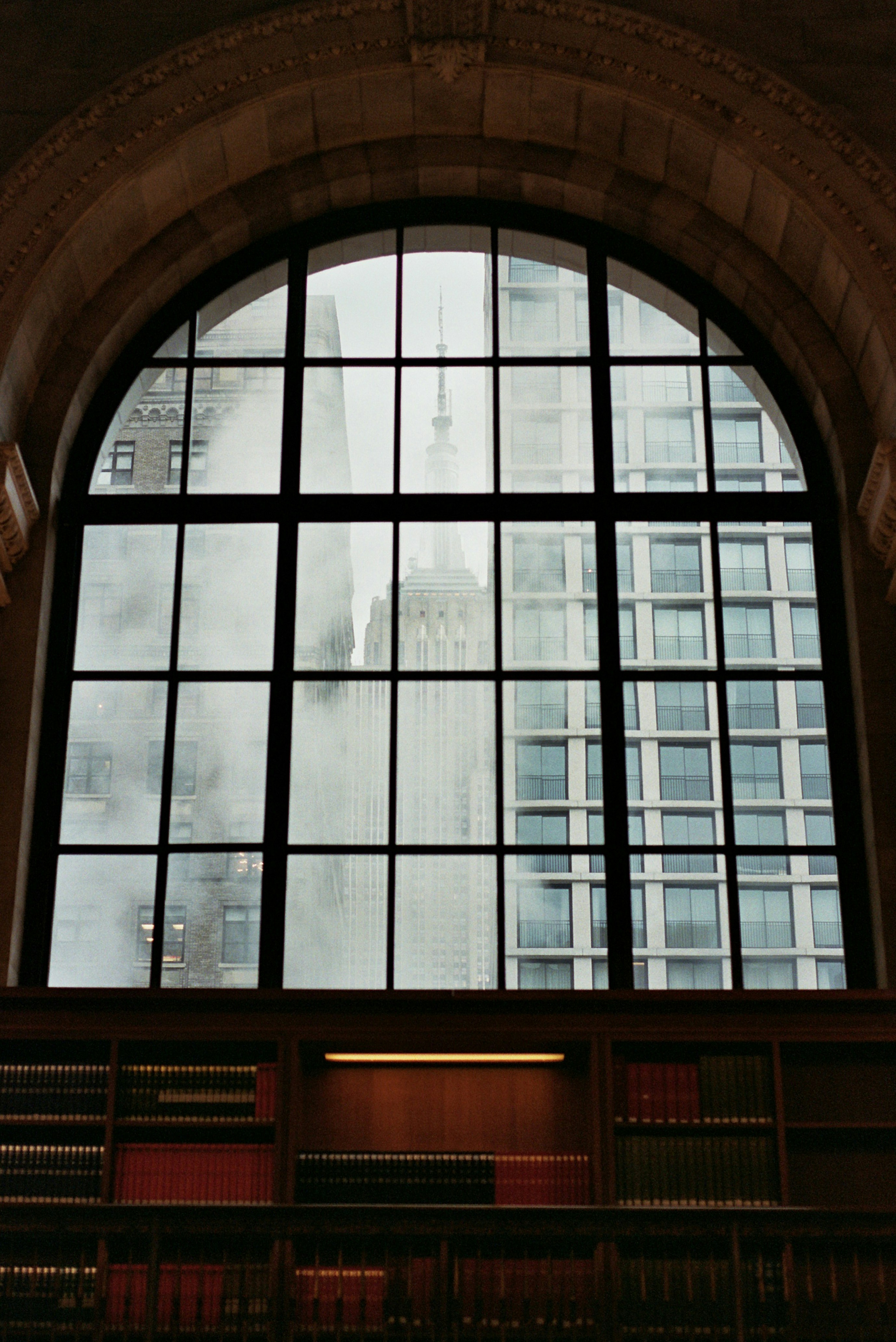 A large window with a view of a building photo – Free New york Image on ...