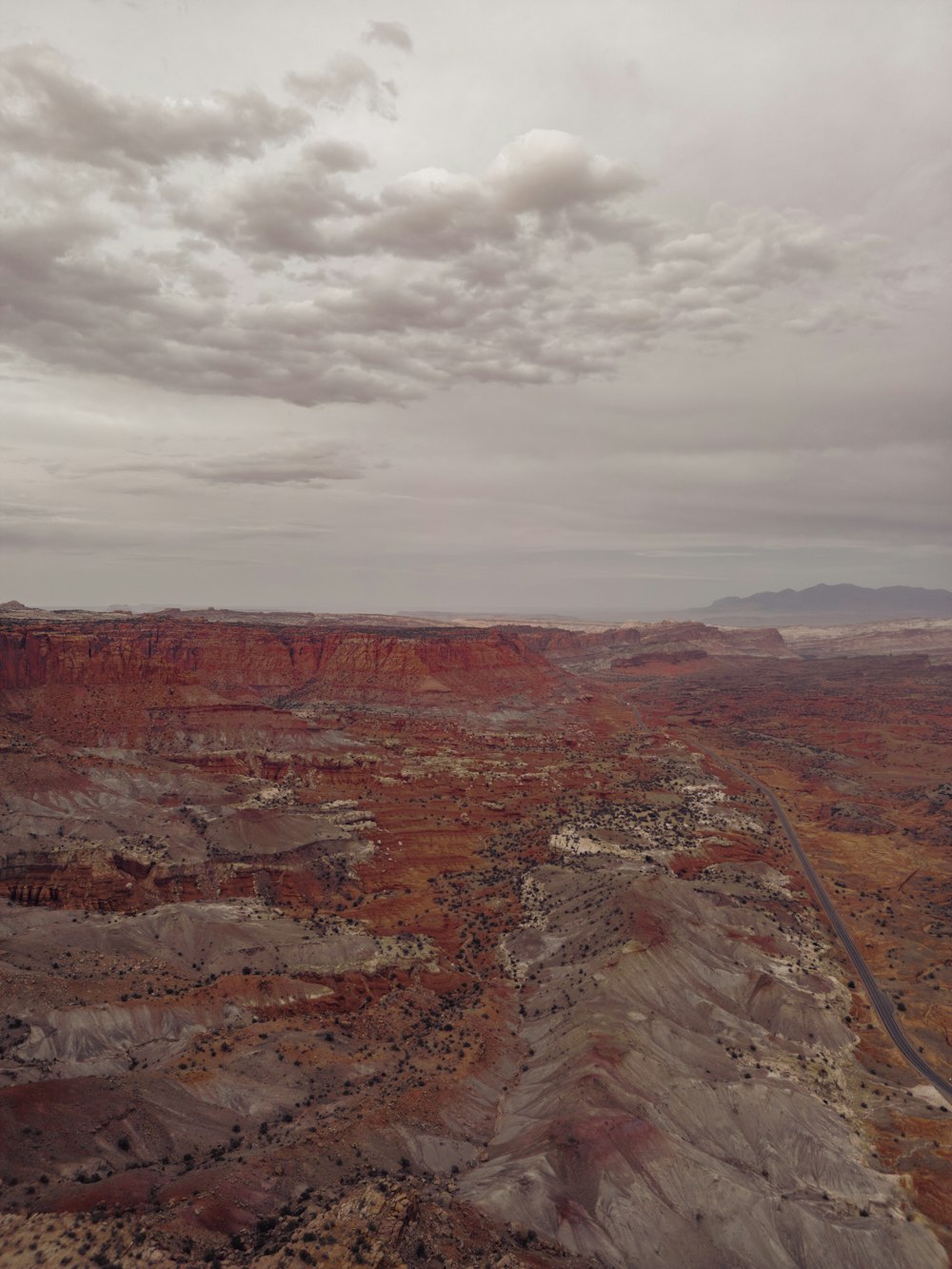 an aerial view of a canyon with a road running through it