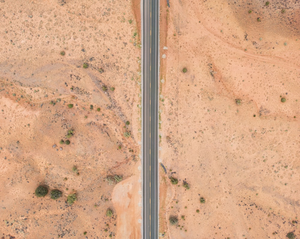 an aerial view of two roads in the desert