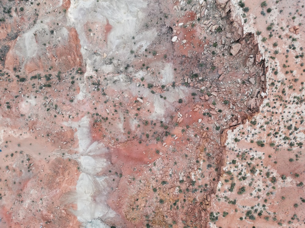 an aerial view of a red and white rock