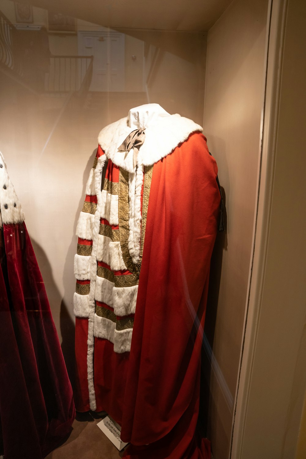 a red and white robe and a red and white coat