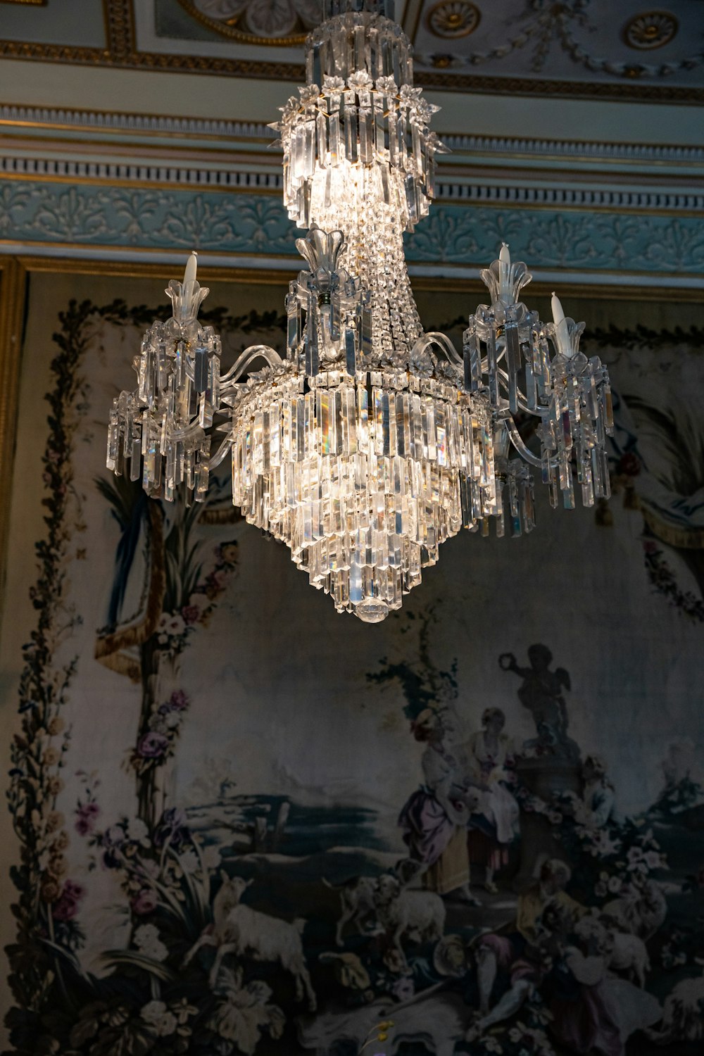 a chandelier hanging from a ceiling in a room