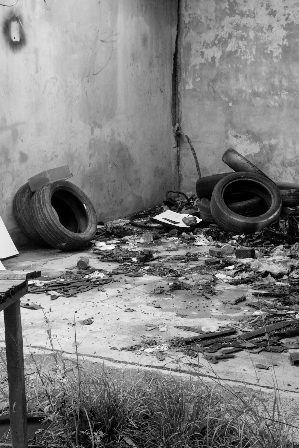 a black and white photo of a broken down building