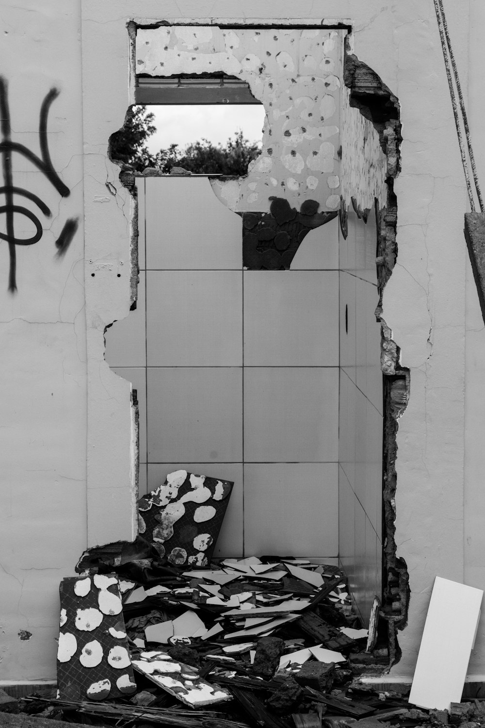 a black and white photo of a broken mirror