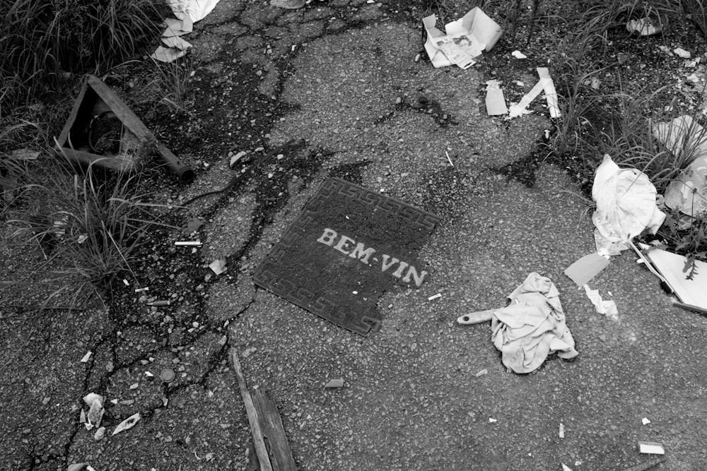 a black and white photo of trash on the ground