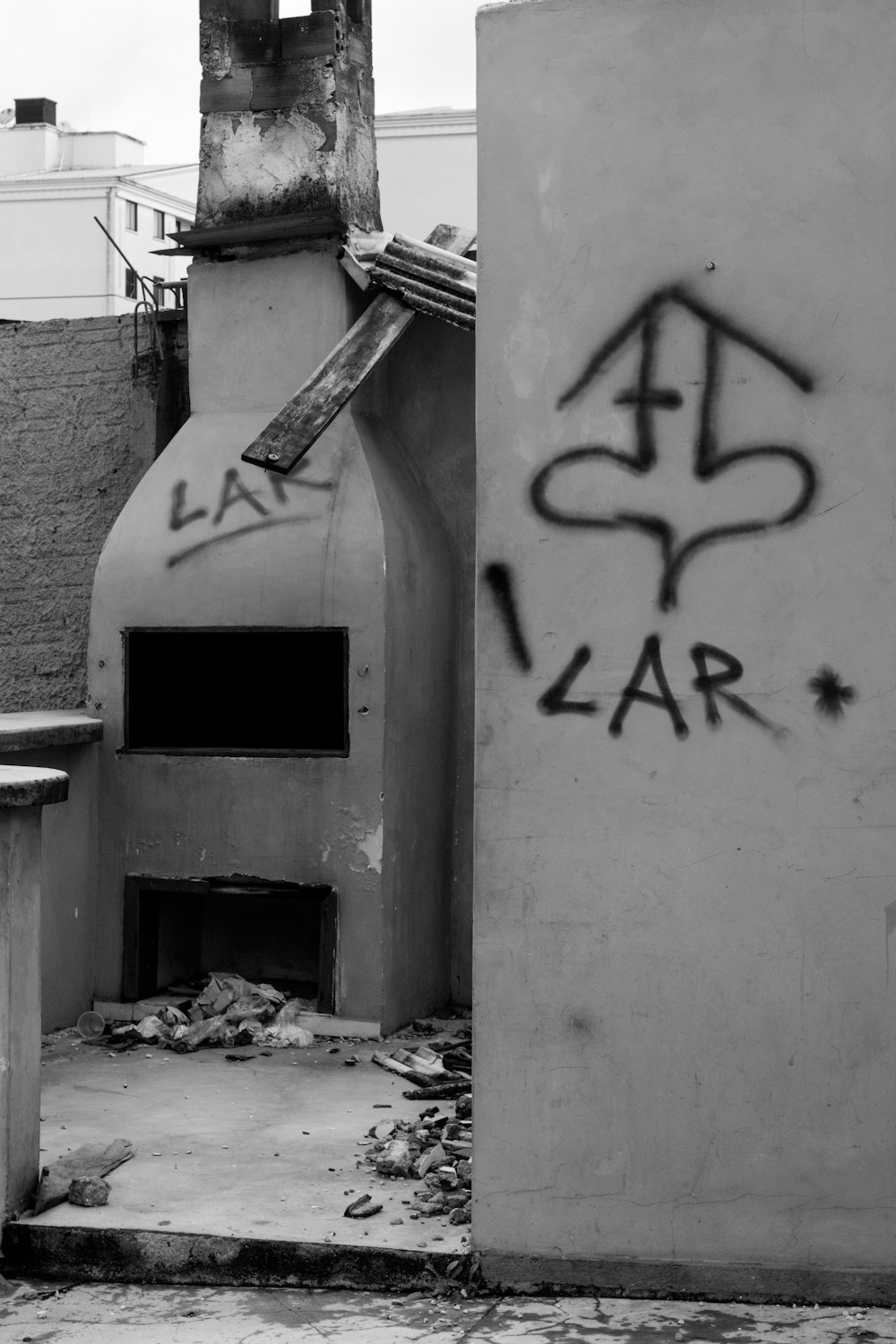 a black and white photo of graffiti on a building