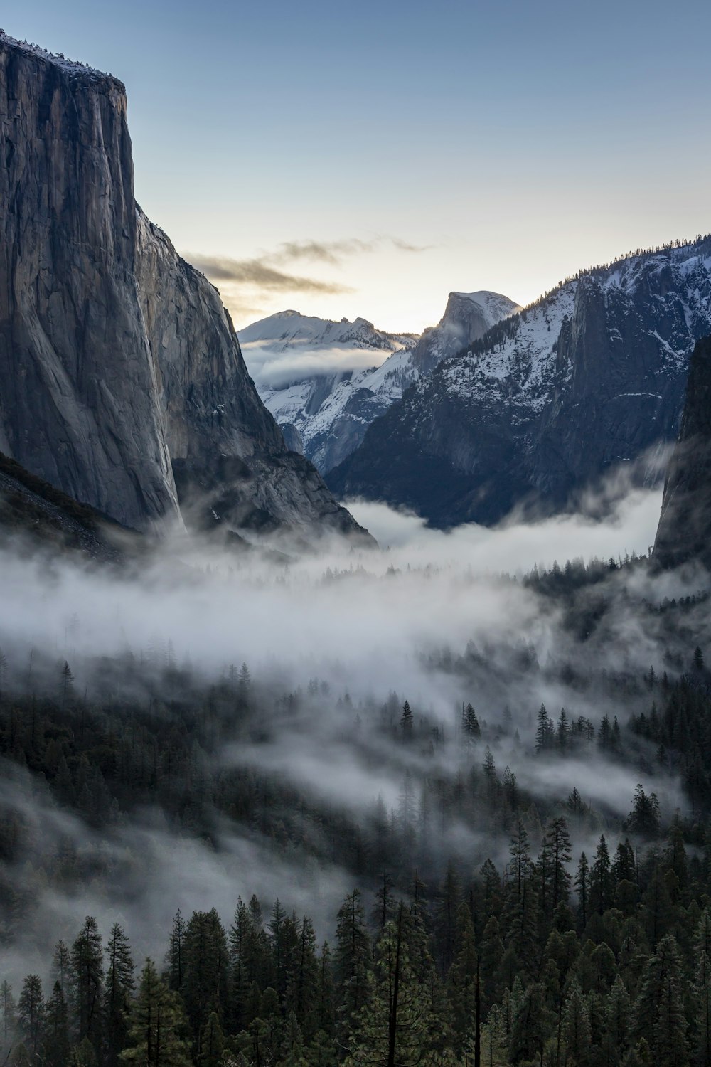 a view of a valley with mountains in the background