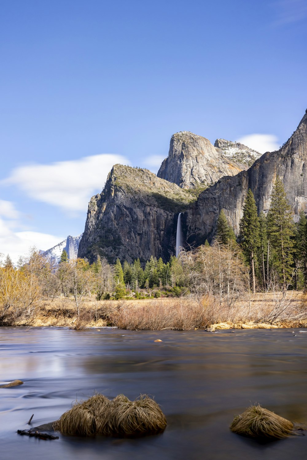 a river with a waterfall in the background