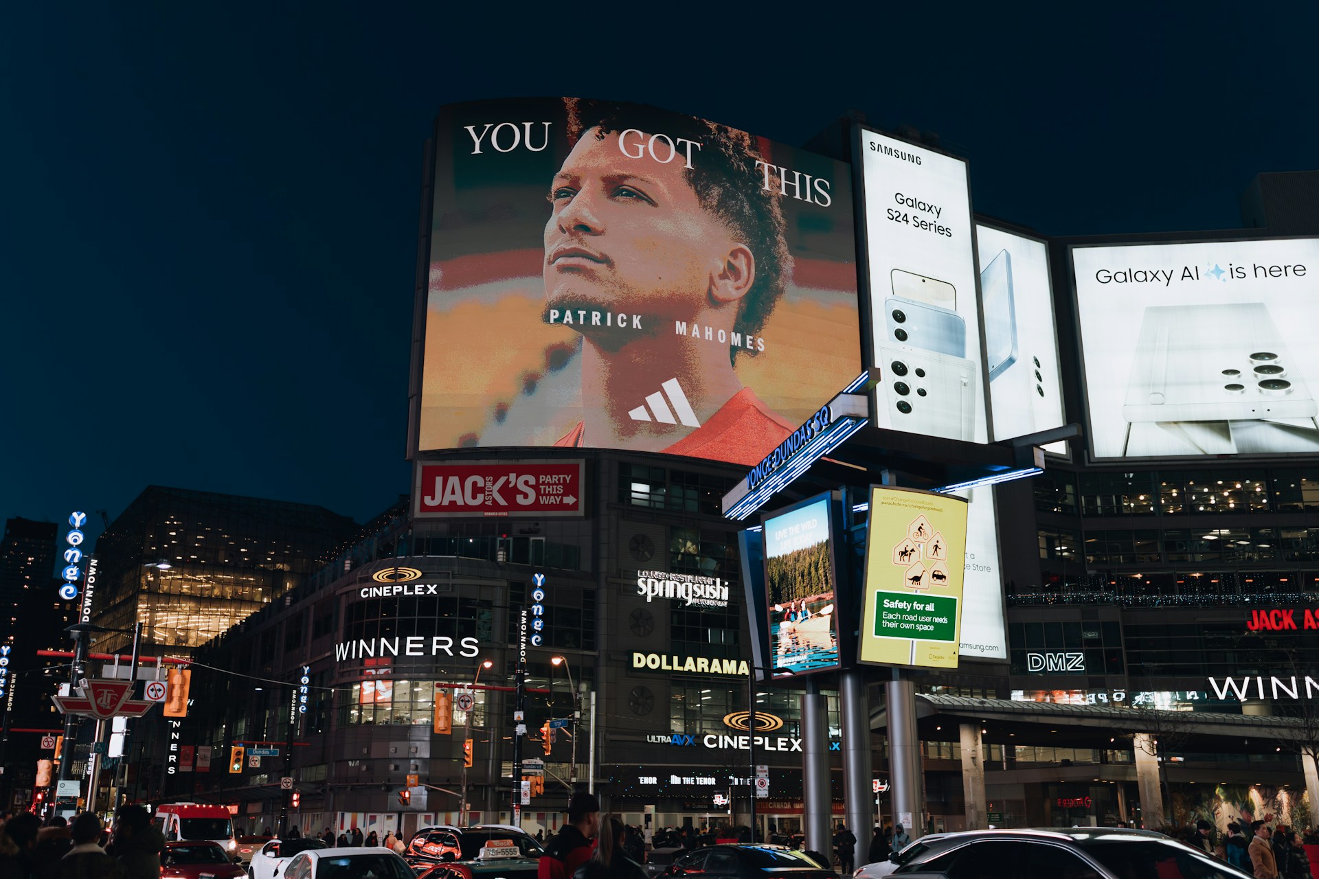 a city street filled with lots of tall buildings