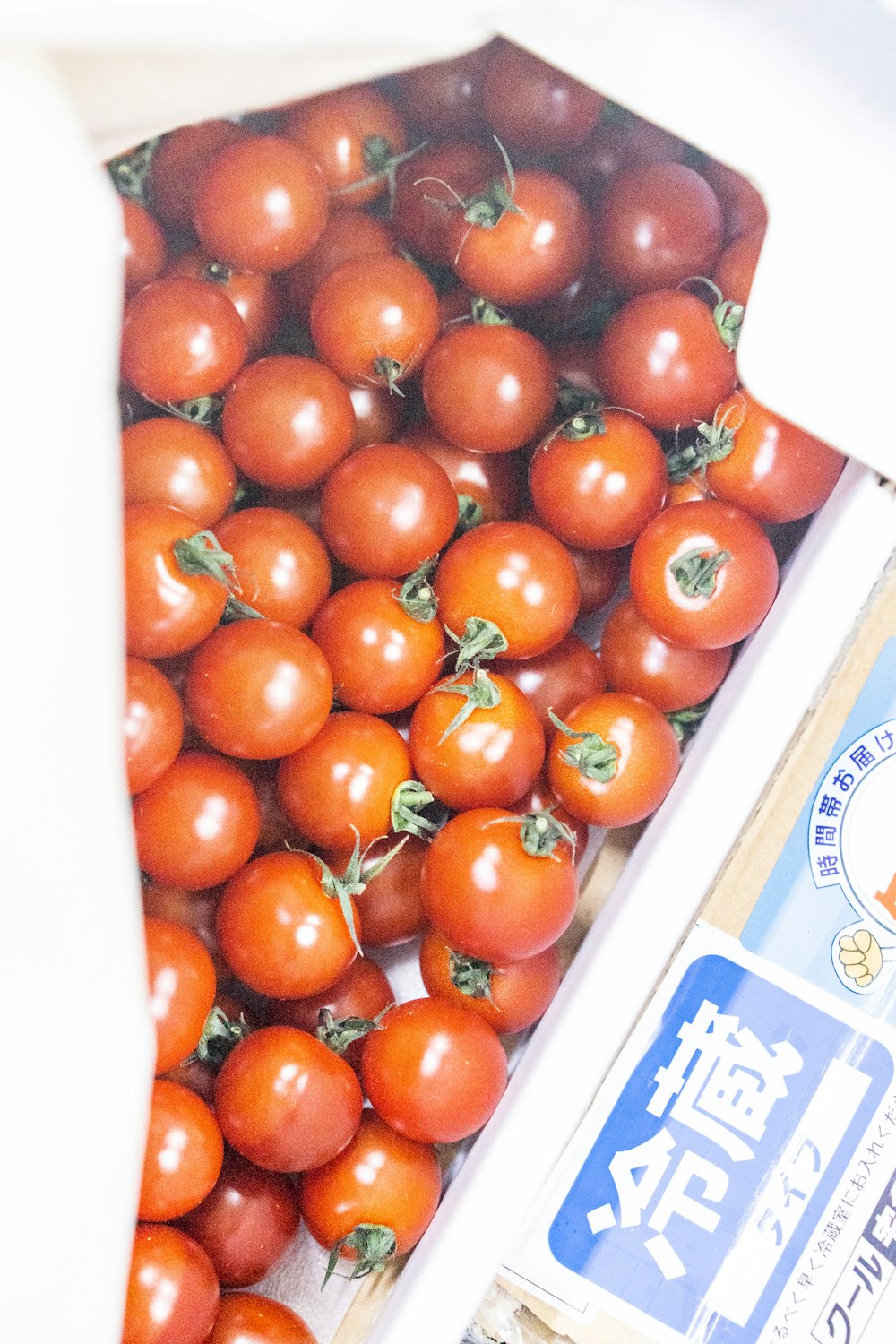 a bunch of tomatoes are in a box