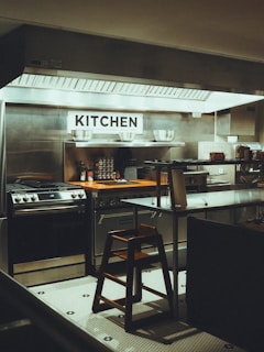 a kitchen that has a stool in it