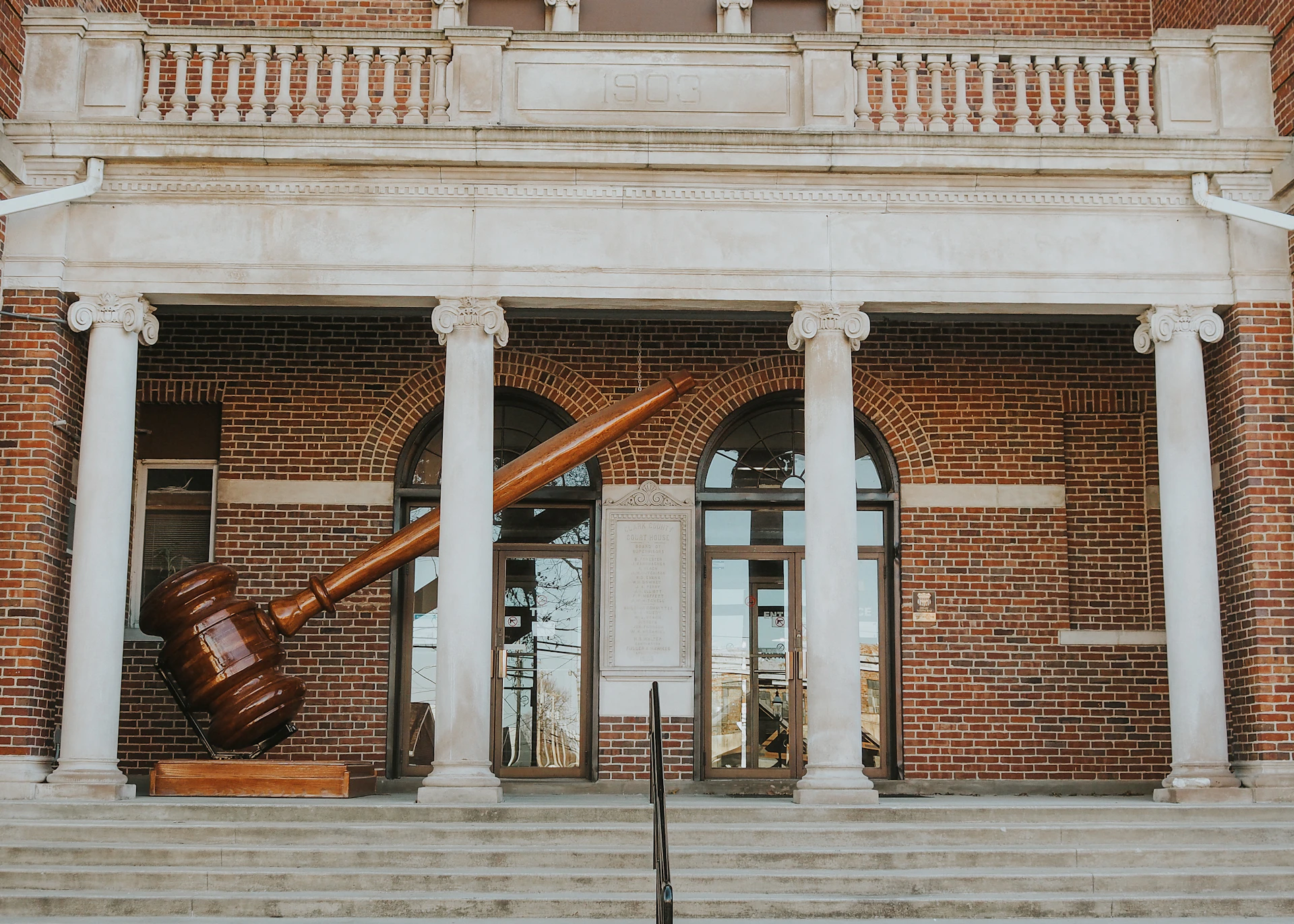 a large wooden object sitting in front of a building