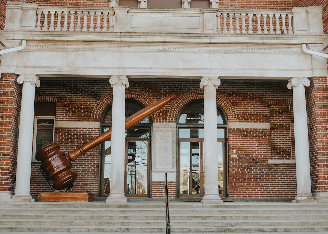 a large wooden object sitting in front of a building,