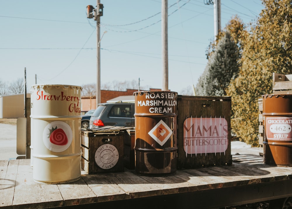 a couple of barrels sitting on top of a wooden table