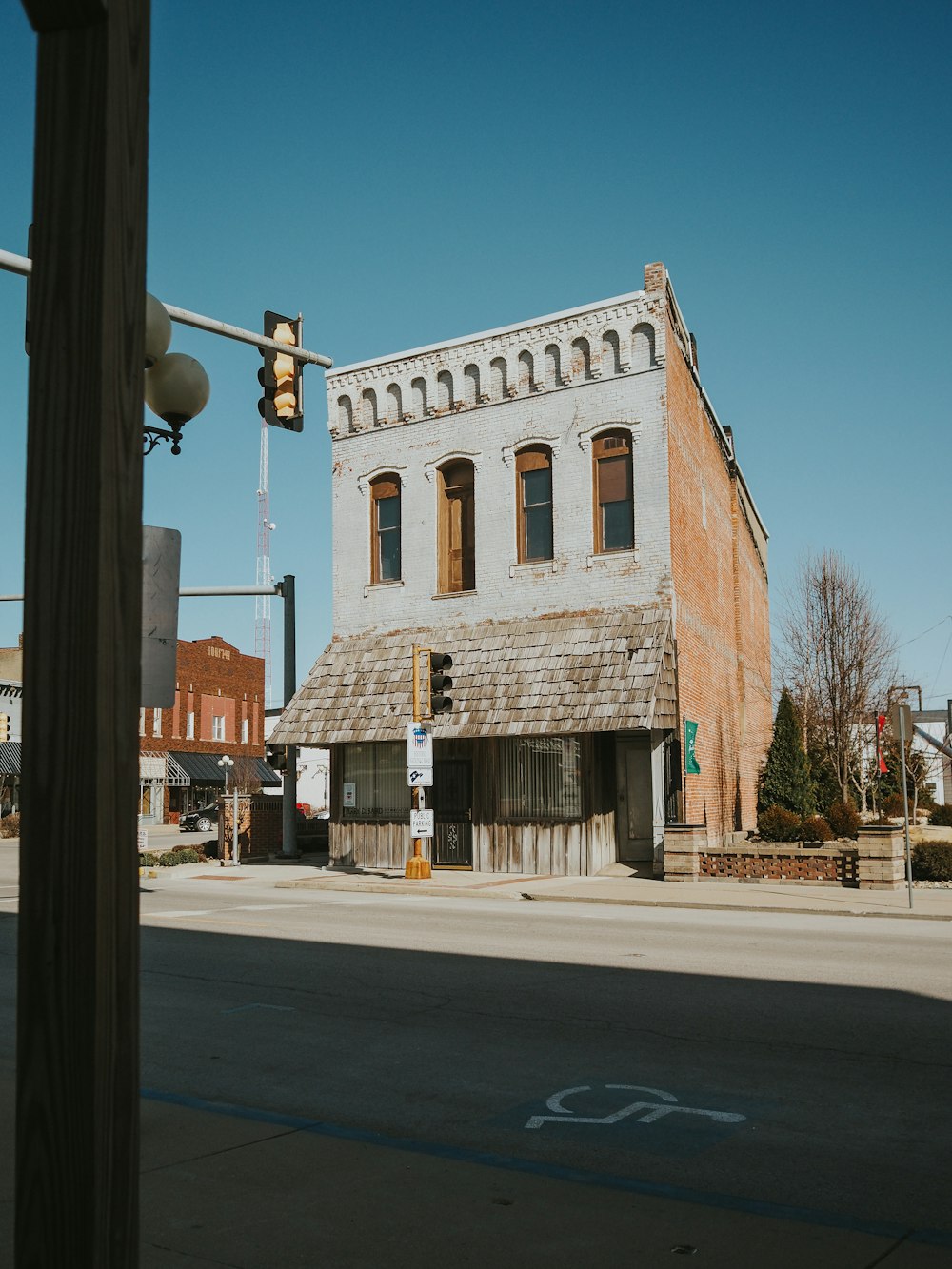 an old run down building on the corner of a street