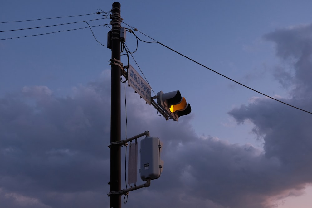 a traffic light sitting on the side of a road