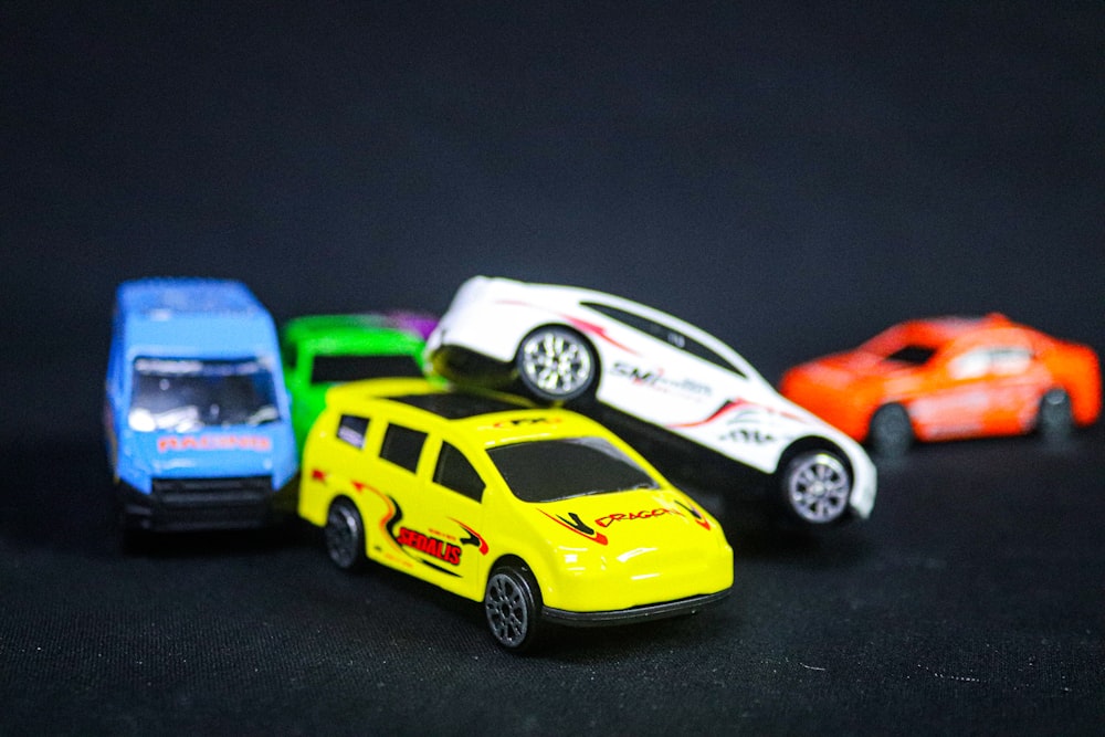 a group of toy cars sitting on top of a table