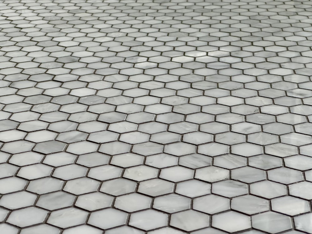 a close up of a tiled floor with hexagonal tiles
