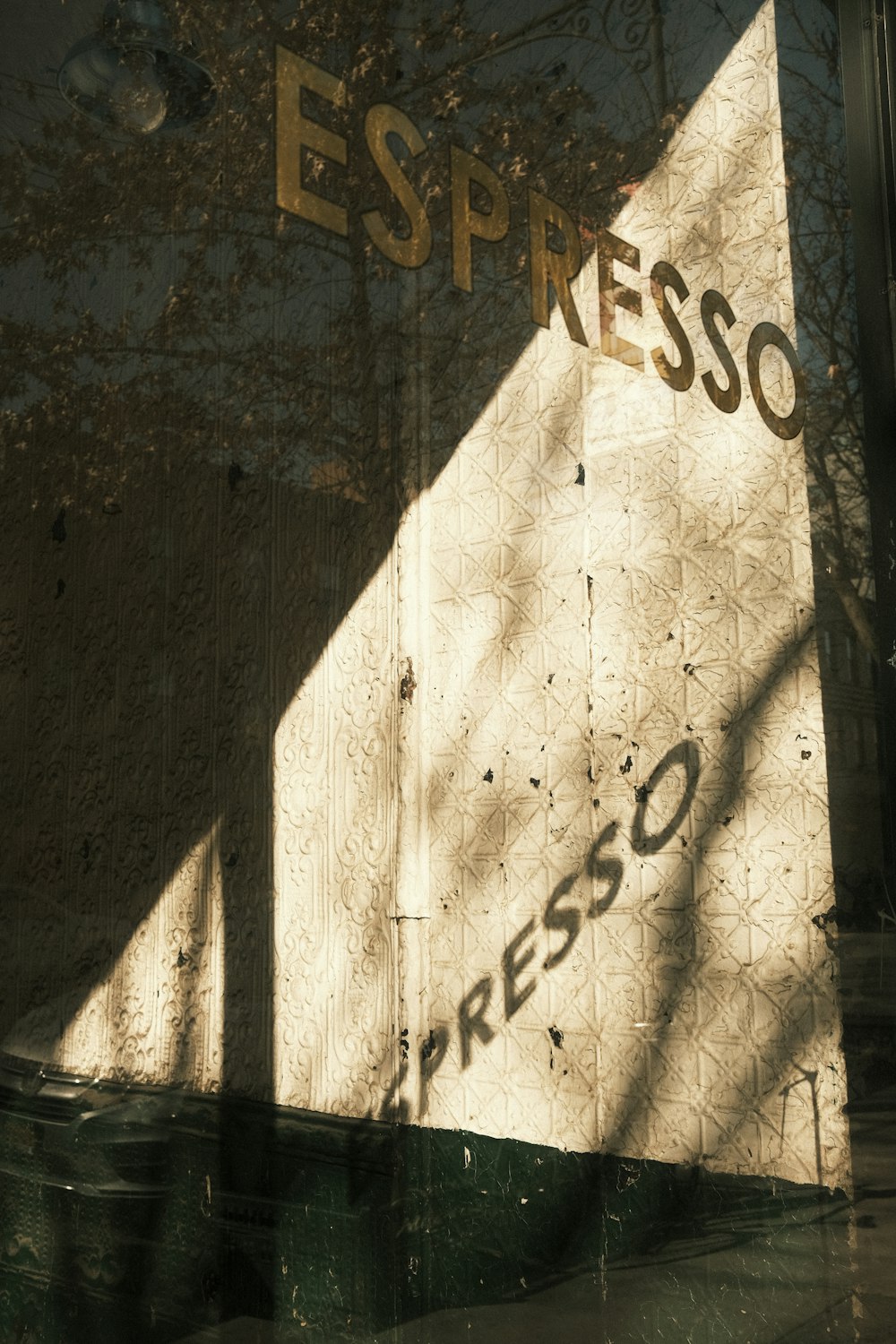 a reflection of a building in a window