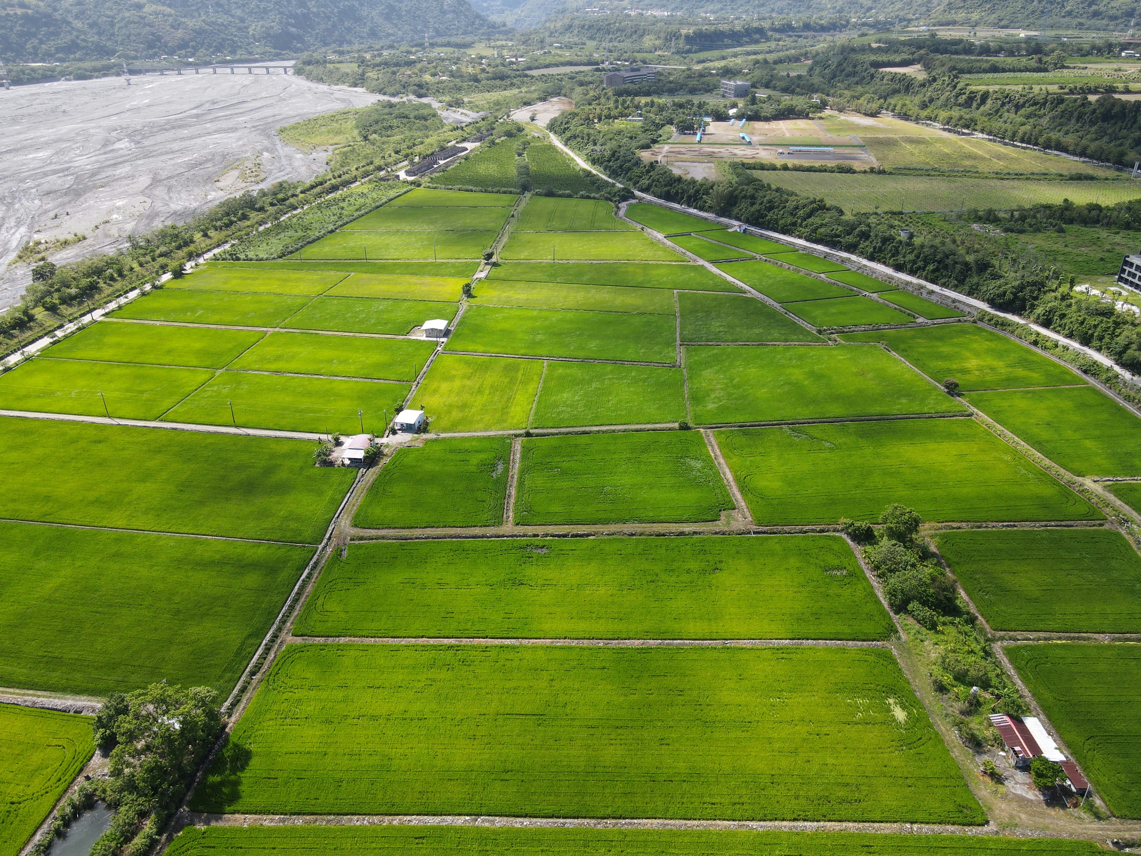 an aerial view of a large green field