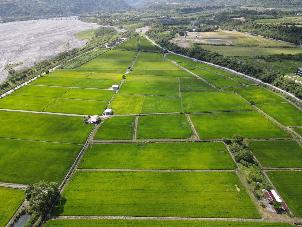 an aerial view of a large green field