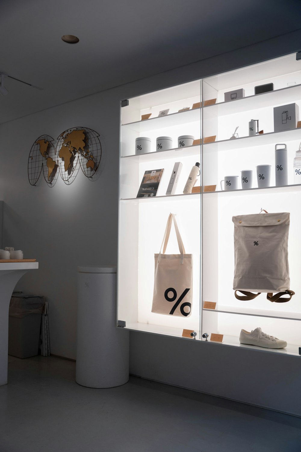 a display case filled with bags and other items