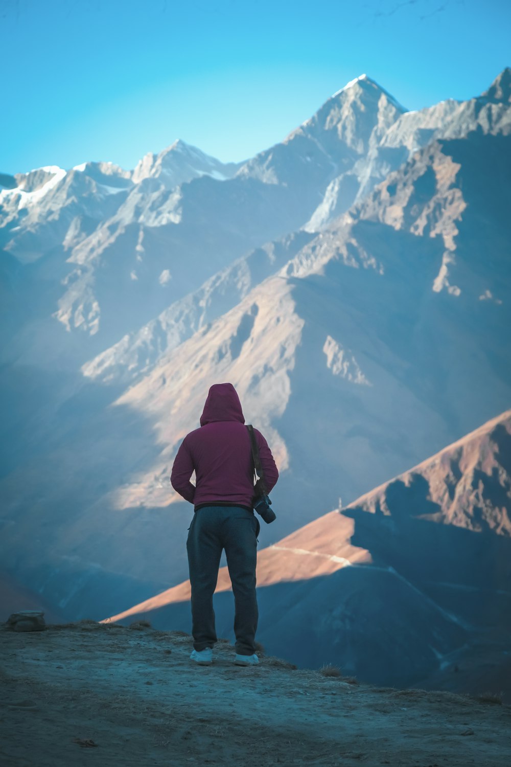 a person standing on top of a mountain