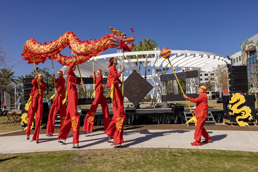 a group of people in red and yellow costumes