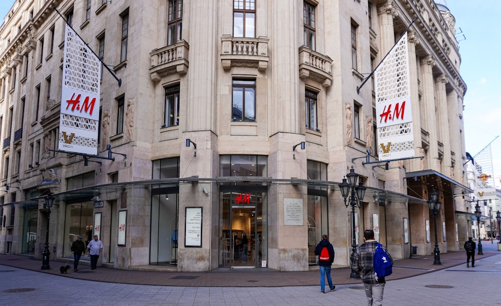 a couple of people that are standing in front of a building