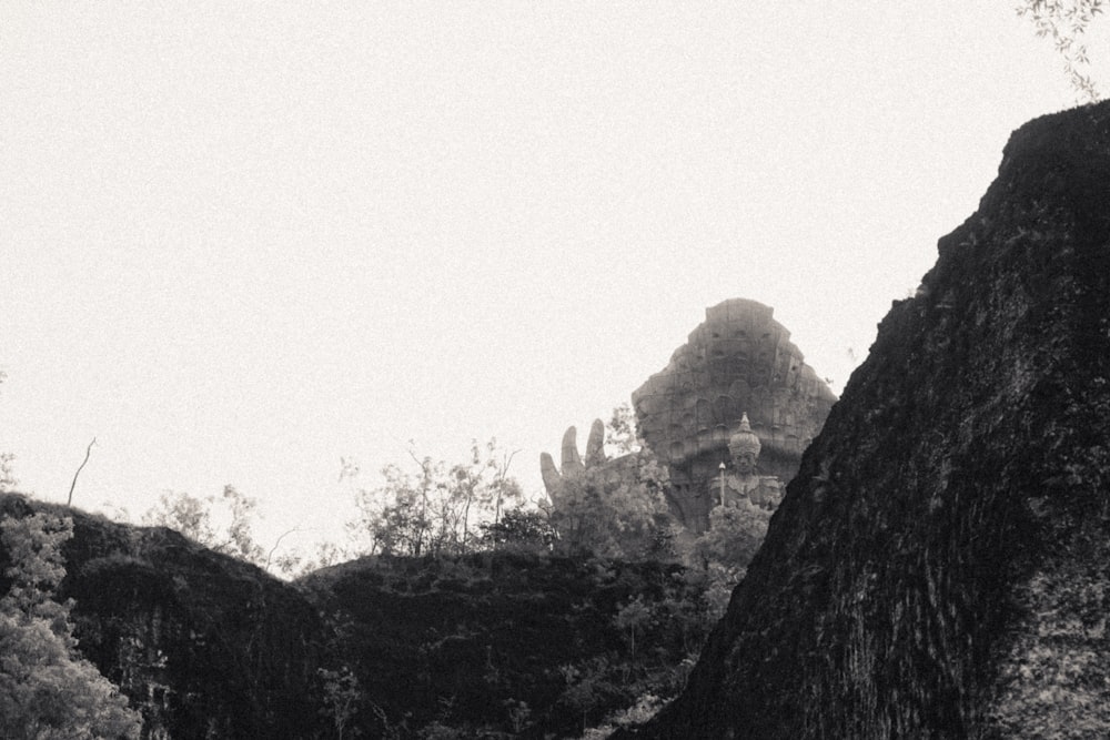 a black and white photo of a mountain side