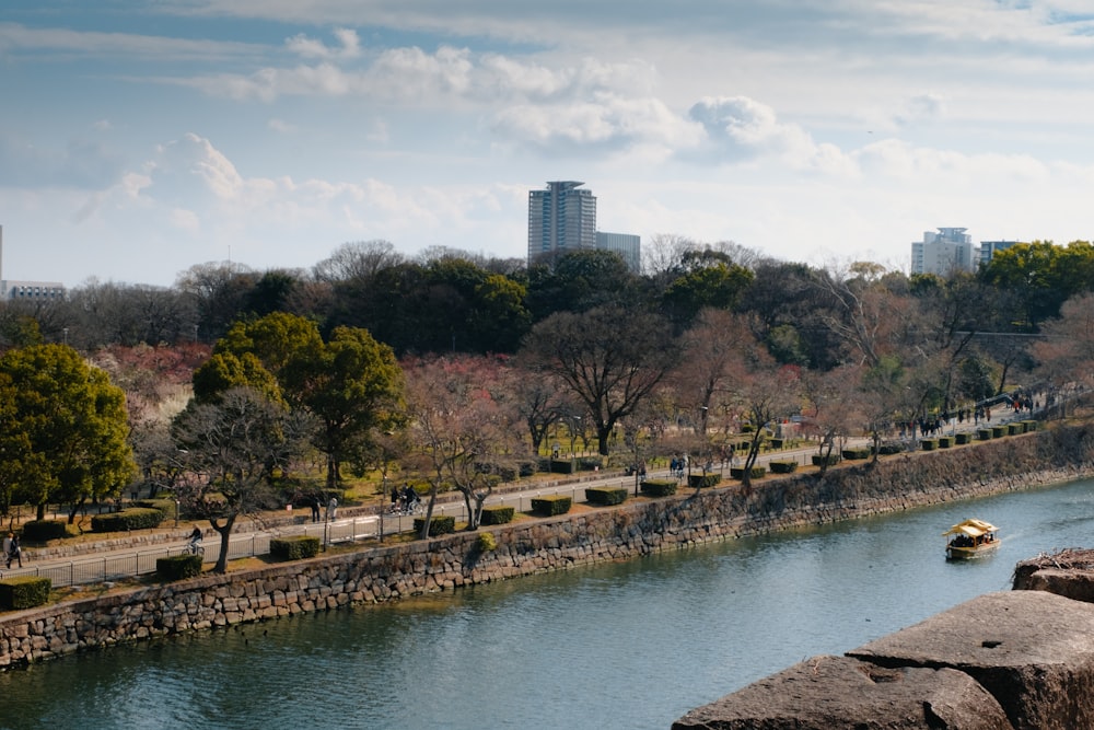 a body of water surrounded by trees and buildings