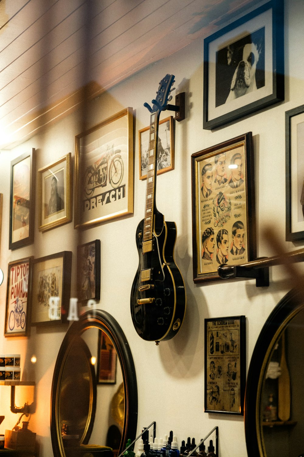 a guitar is hanging on the wall of a room