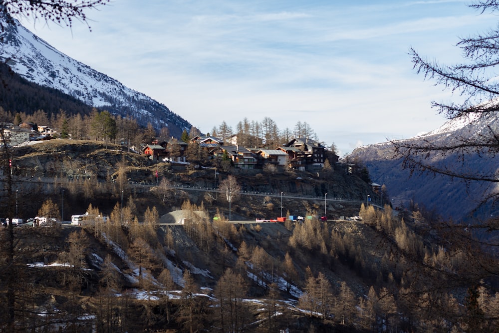 a scenic view of a mountain with houses on it