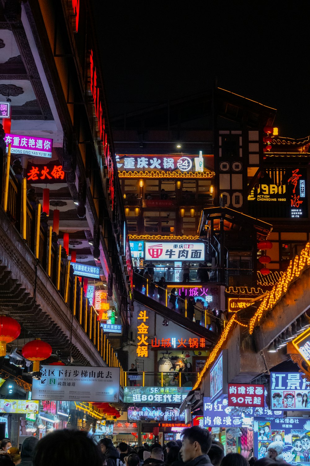 a city street filled with lots of neon signs