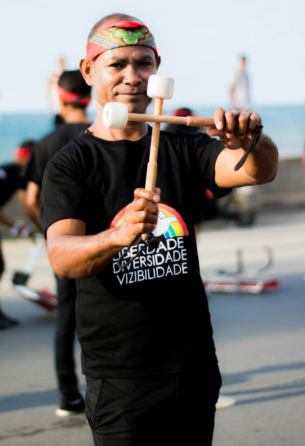 a man holding a mallet in his right hand